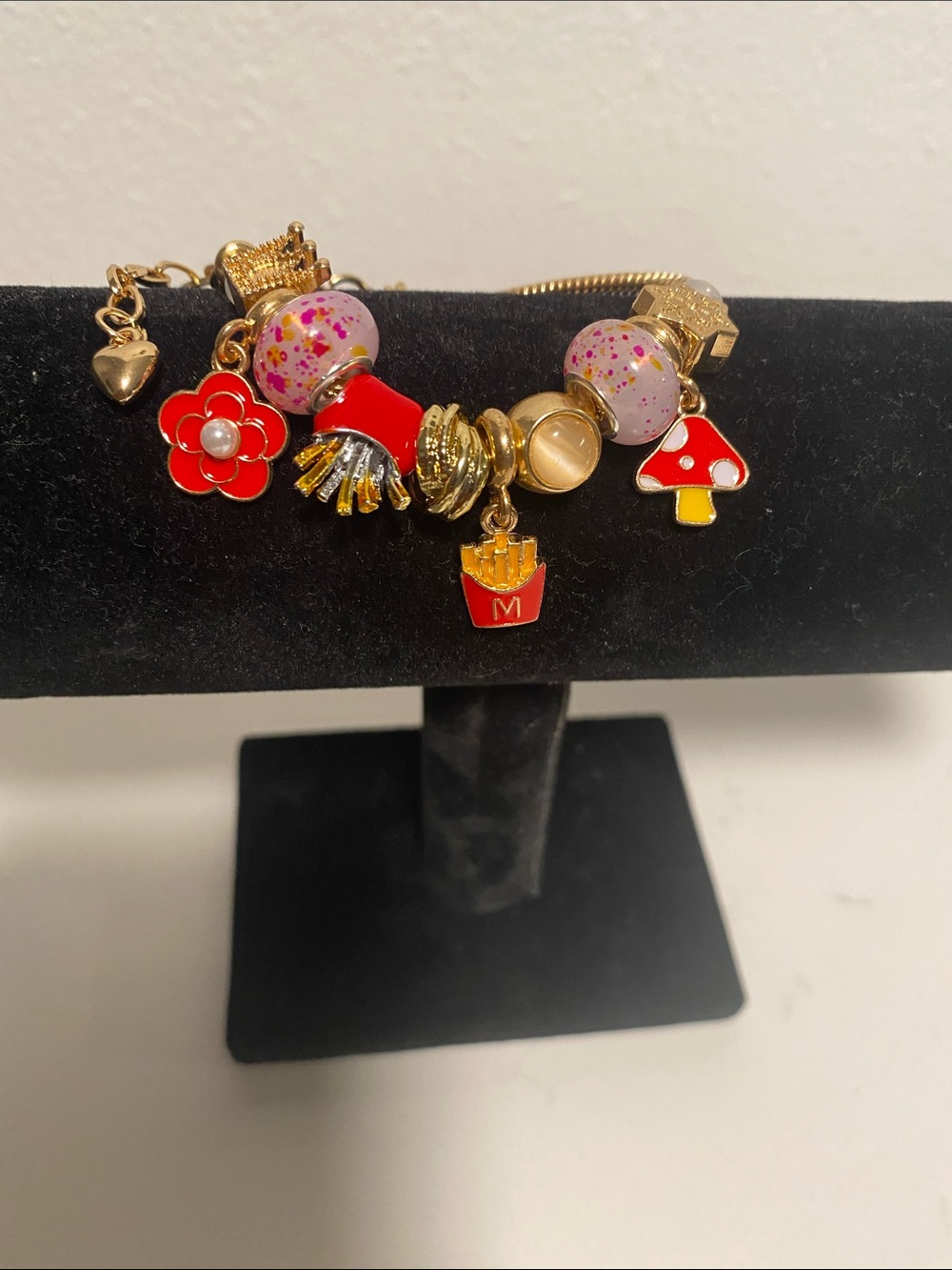 Gold Charm Bracelet with Red Enamel Accents